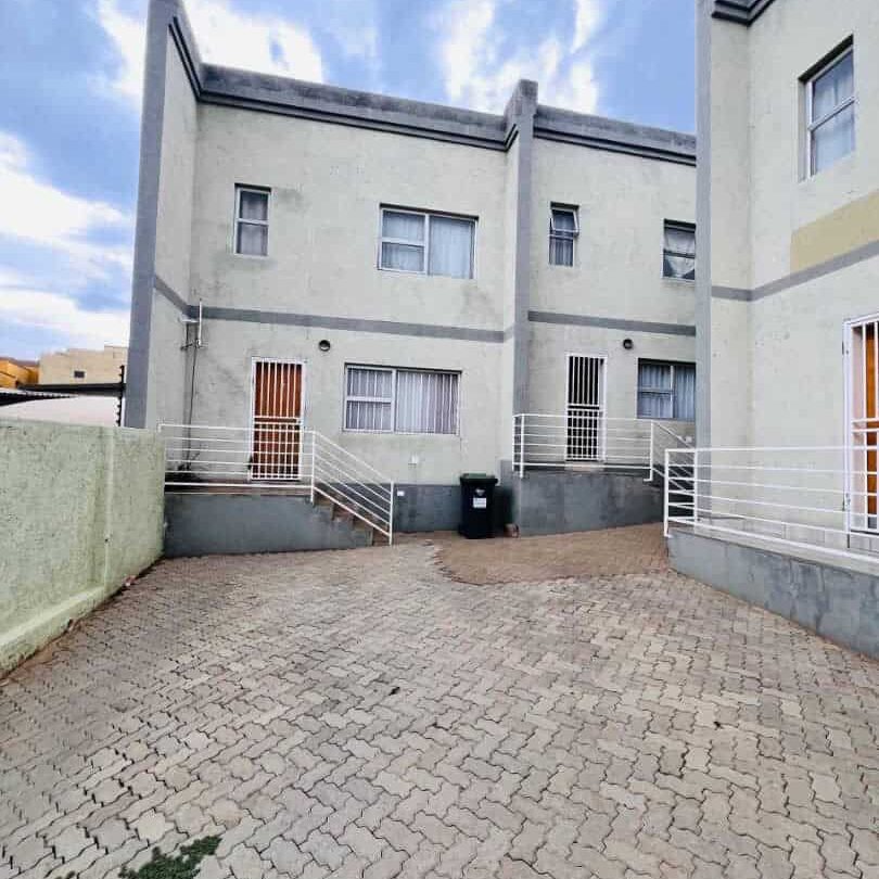 Modern 2 bedroom duplex interior Khomasdal Windhoek Oshipaya complex Double-story duplex unit kitchen BIC BIS Khomasdal Windhoek